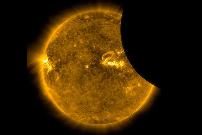 Image of the Moon transiting across the Sun, taken by SDO in 171 angstrom extreme ultraviolet light